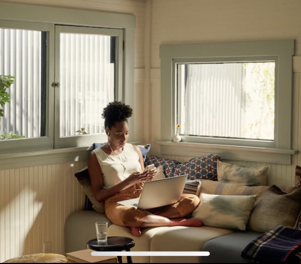 Woman working comfortably on laptop in apartment